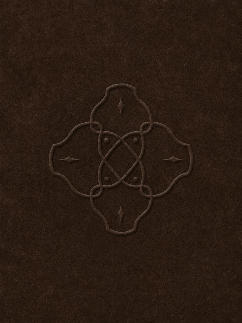 The ORVAIN mark, blind embossed into dark suede